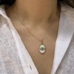 Oval shell necklace with eye charm